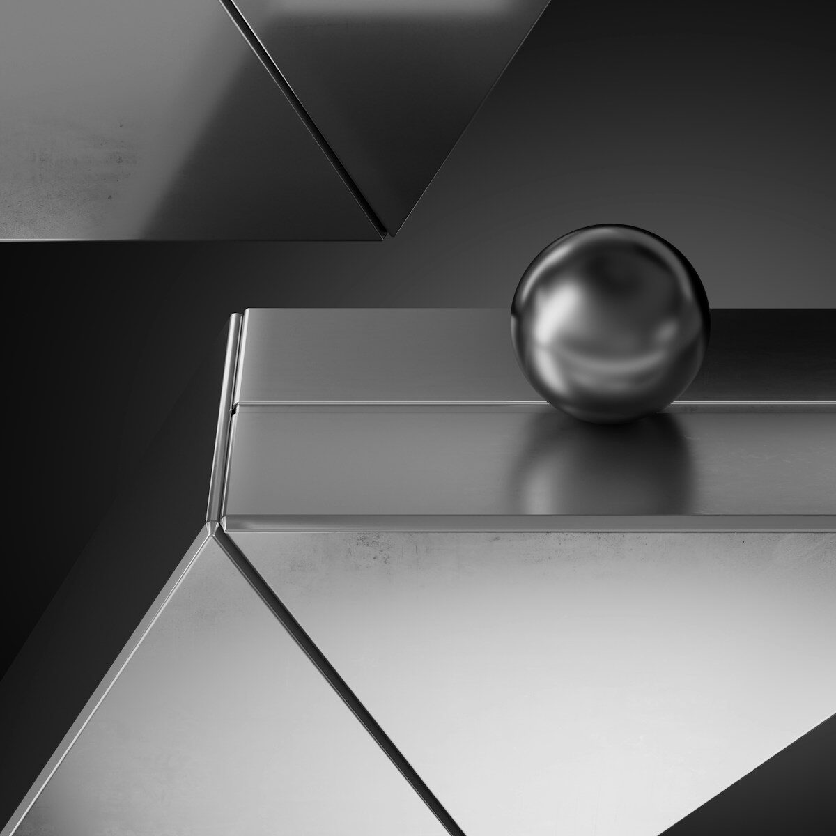 A shiny metal object with a ball on top of it
